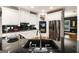 Modern kitchen featuring sleek black countertops, stainless steel appliances, and ample storage space at 543 Wynn Rd, Mcdonough, GA 30252