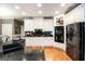 Bright and airy kitchen with granite countertops, stainless steel appliances, and white cabinetry at 543 Wynn Rd, Mcdonough, GA 30252