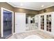 Main bathroom with tile floors, glass enclosed shower, and access to the closet space at 543 Wynn Rd, Mcdonough, GA 30252