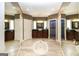 Spacious main bathroom with dual vanities, a soaking tub, and a glass-enclosed shower at 543 Wynn Rd, Mcdonough, GA 30252