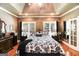 Spacious main bedroom with tray ceiling, hardwood floors, and ample natural light at 543 Wynn Rd, Mcdonough, GA 30252