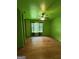 Unique bedroom with green walls and hardwood floors at 402 Stone St, Oxford, GA 30054