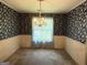 Dining room with chandelier, floral wallpaper, window at 402 Stone St, Oxford, GA 30054