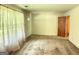Large living room with original details and neutral carpet at 402 Stone St, Oxford, GA 30054