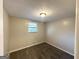 Neutral bedroom with a single window, carpet flooring and base molding at 5670 Bob White Ln, Douglasville, GA 30135
