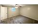 Bright bedroom with a ceiling fan, neutral carpet, single window and white trim and doors at 5670 Bob White Ln, Douglasville, GA 30135