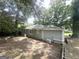 The backyard featuring new paint and a shady backyard at 2500 Brentwood Rd, Decatur, GA 30032