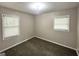 Cozy bedroom with neutral walls and carpet, and ample natural light at 2500 Brentwood Rd, Decatur, GA 30032