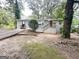 View of the home showcasing new exterior paint, landscaping and entry stairways at 2500 Brentwood Rd, Decatur, GA 30032