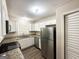 Modern kitchen with white cabinets, granite countertops, and stainless steel appliances at 2500 Brentwood Rd, Decatur, GA 30032