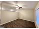 Spacious bedroom with ceiling fan, wood-look flooring, and neutral-colored walls for a serene atmosphere at 410 Tarragon Sw Way, Atlanta, GA 30331