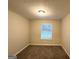 Bright bedroom with carpeting, neutral-colored walls, and a window providing natural light at 410 Tarragon Sw Way, Atlanta, GA 30331