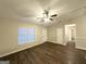 Inviting living room with wood-look flooring, natural light, and open access to other areas at 410 Tarragon Sw Way, Atlanta, GA 30331
