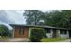 Inviting home featuring painted brick, wood siding, and well-manicured landscaping at 4916 Campbellton Sw Rd, South Fulton, GA 30331