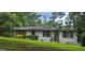 Charming single-story home with painted white brick and well-maintained lawn and landscaping at 4916 Campbellton Sw Rd, South Fulton, GA 30331