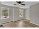 Spacious bedroom featuring natural light from the large windows and ceiling fan at 583 Whitaker Nw St, Atlanta, GA 30318