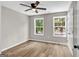 Bright bedroom featuring wood-look floors, neutral walls, and large windows for natural light at 583 Whitaker Nw St, Atlanta, GA 30318