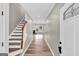 Inviting entryway featuring new floors, fresh paint, and a view to the living room and fireplace at 583 Whitaker Nw St, Atlanta, GA 30318