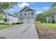 Beautiful two-story home features a long driveway and a freshly sodded yard at 583 Whitaker Nw St, Atlanta, GA 30318