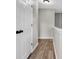 Upstairs hallway featuring modern flooring, neutral paint, and natural light creating a welcoming space at 583 Whitaker Nw St, Atlanta, GA 30318