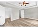 Main bedroom featuring tray ceiling, ceiling fan, closet, and ensuite bathroom, great for privacy and storage at 583 Whitaker Nw St, Atlanta, GA 30318