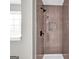 Updated shower featuring modern tile, built-in niche, and sleek fixtures providing a spa-like experience at 583 Whitaker Nw St, Atlanta, GA 30318