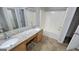 Bathroom featuring granite vanity top, sink and shower-tub combo at 2378 Charleston Se Pt, Atlanta, GA 30316