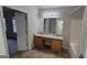 Bathroom featuring a double vanity with granite countertop and shower-tub combo at 2378 Charleston Se Pt, Atlanta, GA 30316