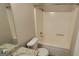 Bathroom featuring granite vanity, toilet and shower-tub combo at 2378 Charleston Se Pt, Atlanta, GA 30316
