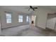 Bedroom with multiple windows, ceiling fan and view into bathroom at 2378 Charleston Se Pt, Atlanta, GA 30316
