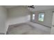 Bedroom with multiple windows and vaulted ceiling and ceiling fan at 2378 Charleston Se Pt, Atlanta, GA 30316