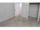 Neutral bedroom with carpet, closet, and view into laundry area through an adjacent doorway at 2378 Charleston Se Pt, Atlanta, GA 30316