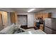 Kitchen with granite countertops, stainless appliances, and wooden cabinets overlooks the utility area and laundry at 2378 Charleston Se Pt, Atlanta, GA 30316