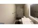 Modern bathroom featuring a marble-tiled shower with a built-in niche and modern fixtures at 3153 Bellgreen Way, Decatur, GA 30032