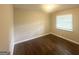 Bright bedroom with hardwood floors, neutral paint, and a large window for natural light at 3153 Bellgreen Way, Decatur, GA 30032