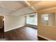 Bright living room featuring hardwood floors, large windows, and stylish coffered ceilings at 3153 Bellgreen Way, Decatur, GA 30032