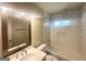 Bright bathroom featuring subway tile, modern fixtures, and a framed mirror at 2327 Scotty Cir, Decatur, GA 30032
