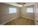 Cozy bedroom featuring wood-look flooring and a ceiling fan at 2327 Scotty Cir, Decatur, GA 30032