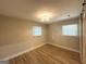 Bright bedroom featuring wood-look flooring and neutral walls at 2327 Scotty Cir, Decatur, GA 30032