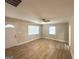 Well-lit living room featuring wood-look flooring, a ceiling fan, and bright windows at 2327 Scotty Cir, Decatur, GA 30032