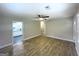 Open living room featuring wood-look flooring and a view into the adjacent kitchen at 2327 Scotty Cir, Decatur, GA 30032