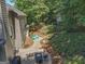 Private backyard with patio seating, manicured landscaping, and a charming playhouse at 220 Lavender Oasis, Peachtree City, GA 30269