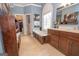 Beautiful bathroom featuring a soaking tub, tile flooring, and a vanity with ample storage at 220 Lavender Oasis, Peachtree City, GA 30269