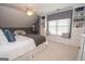 Charming bedroom with a window seat, built-in shelving, and a cozy reading nook at 220 Lavender Oasis, Peachtree City, GA 30269