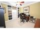 Bright home office features custom built-in shelving, a ceiling fan, and a comfortable workspace at 220 Lavender Oasis, Peachtree City, GA 30269