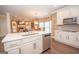 Well-equipped kitchen with stainless steel appliances, large island, and an open layout at 220 Lavender Oasis, Peachtree City, GA 30269