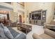 Spacious living room with tall ceilings, comfortable seating, and a view to dining room at 220 Lavender Oasis, Peachtree City, GA 30269