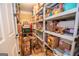 Organized pantry with ample shelving filled with storage boxes and household goods at 220 Lavender Oasis, Peachtree City, GA 30269