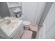 Cozy bathroom featuring a shower with a white curtain and a white sink at 6391 Katherine St, Douglasville, GA 30134