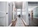 Hallway with wood floors and views of rooms with natural light at 6391 Katherine St, Douglasville, GA 30134